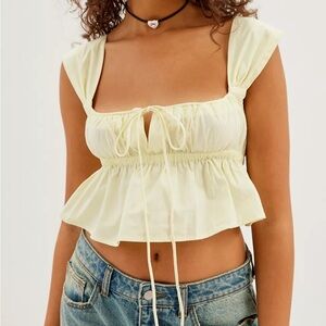 Urban outfitters Sophia soft yellow peplum top - size M